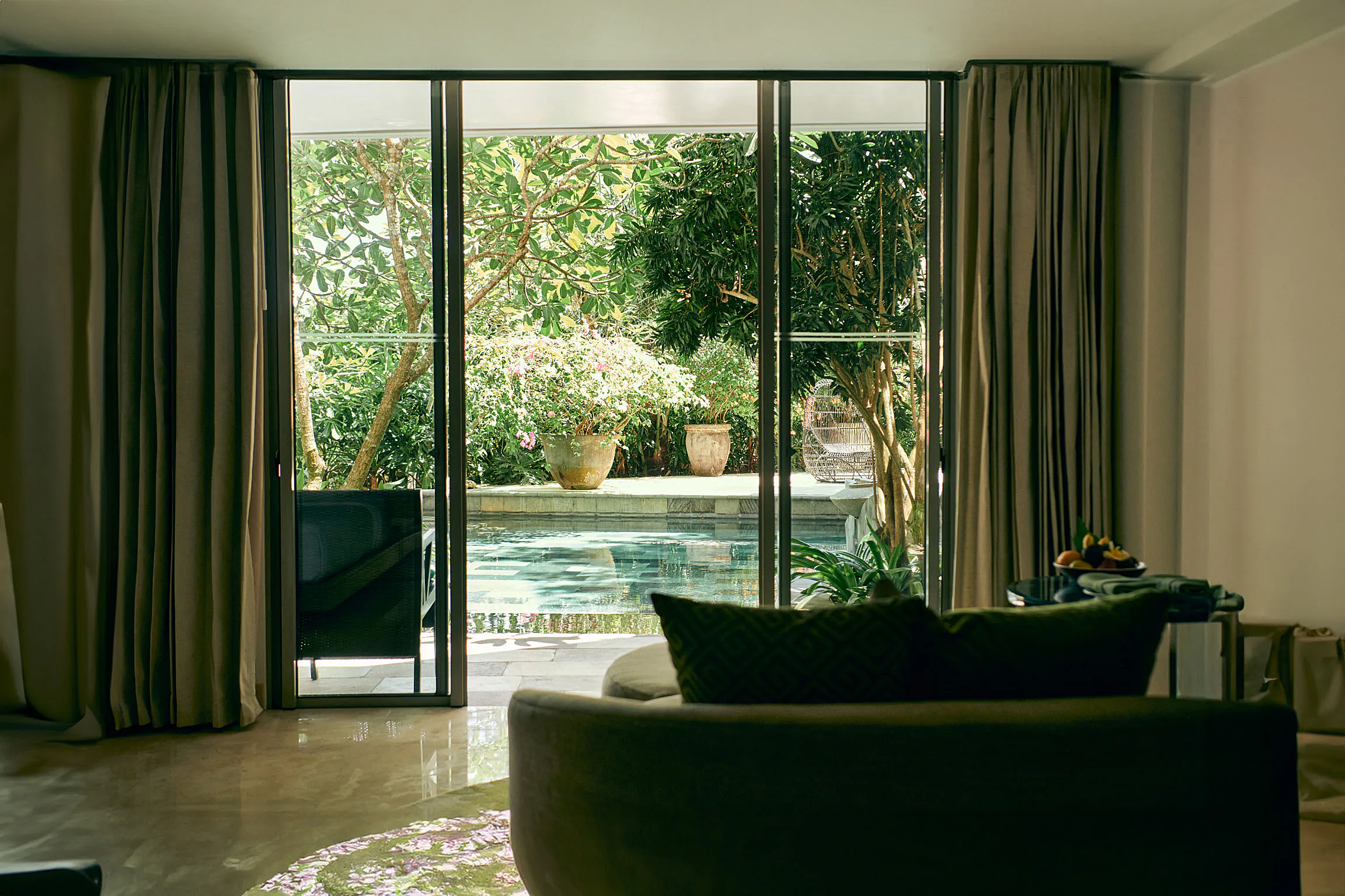 RIMBA by AYANA Bali — multi-level pools fringed by palms