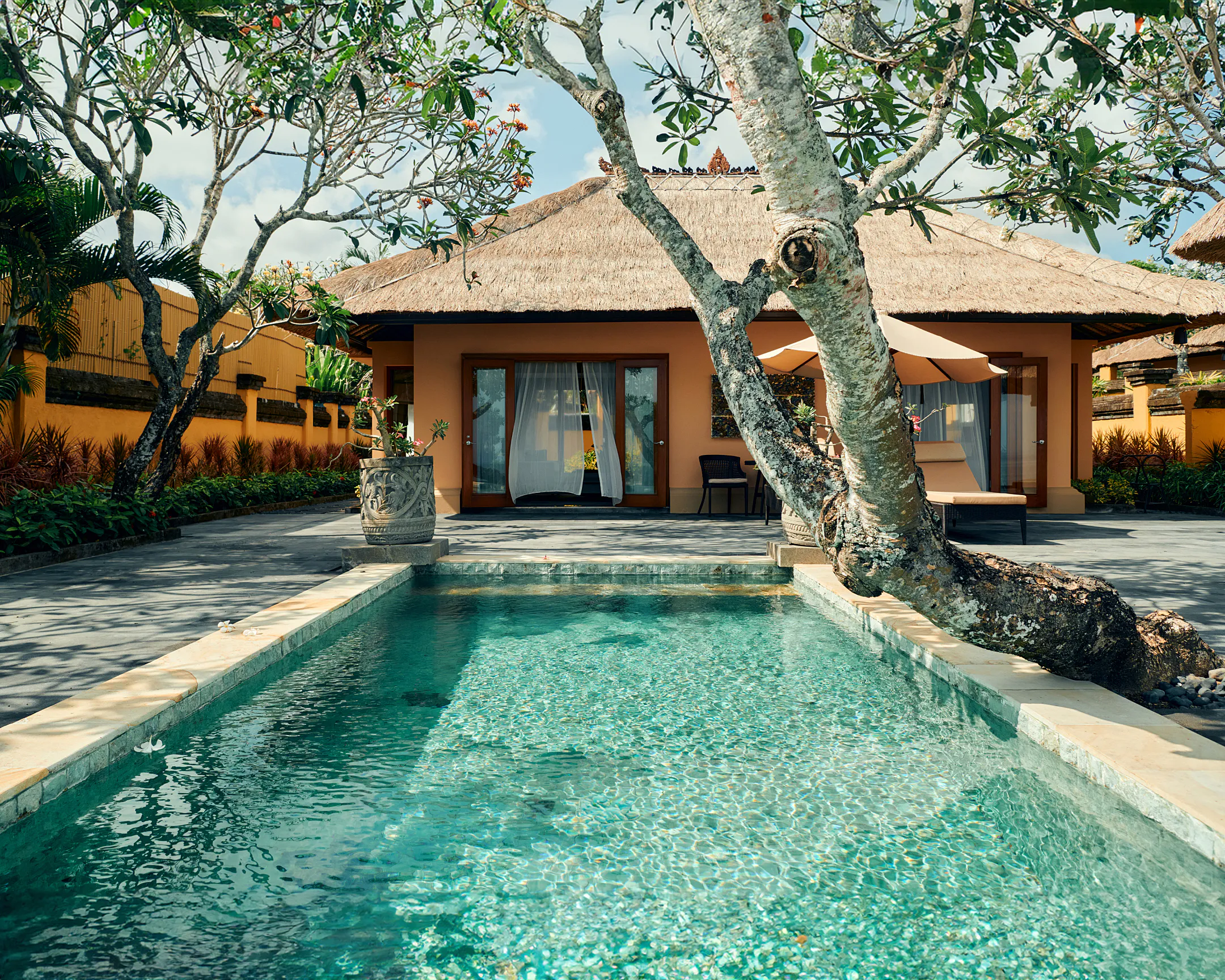 Inside an AYANA Villas guest room, rich with Balinese craftsmanship